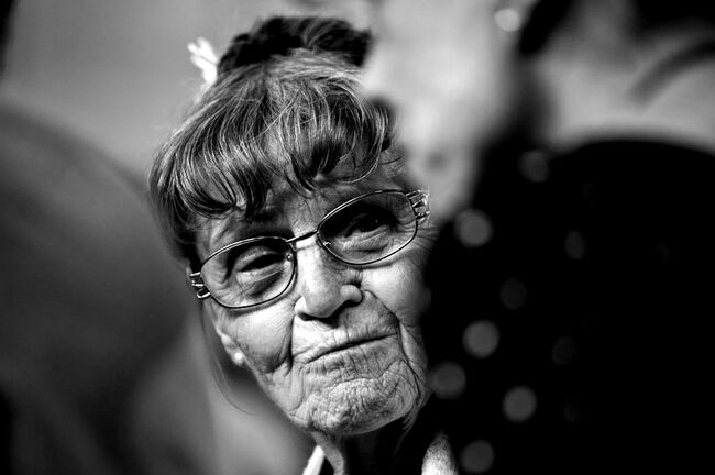 Black and white photo of Ruth Denison wearing glasses, close up